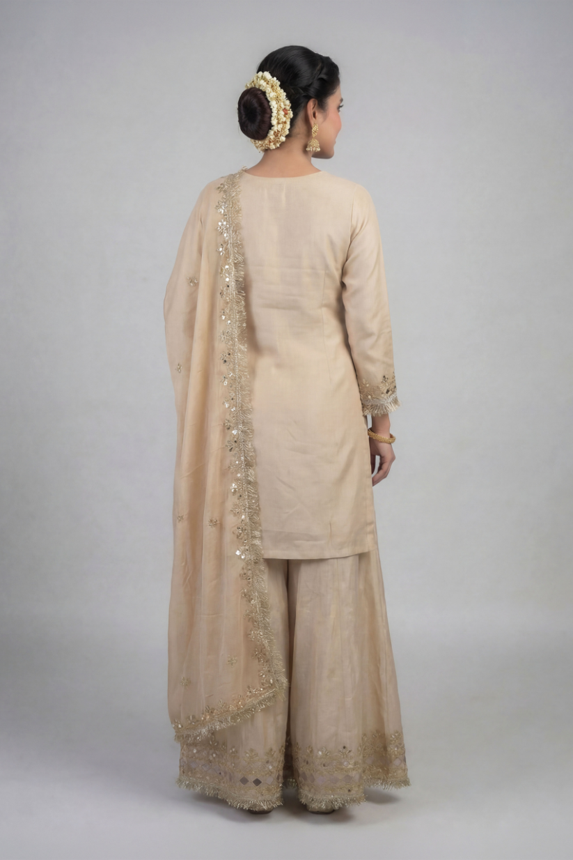 Back view of women beige embroidered palazzo set