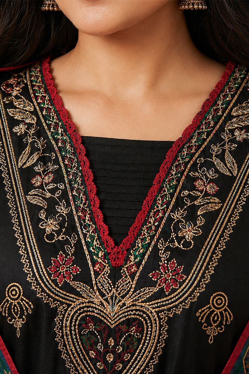 Woman wearing black embroidered ethnic kurta set with printed dupatta front view