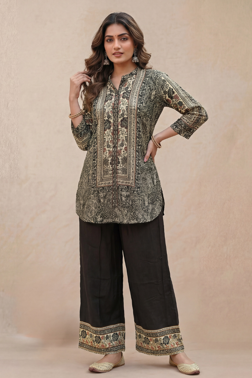 Woman wearing black printed kurta pant set with ethnic floral prints and wide leg pants