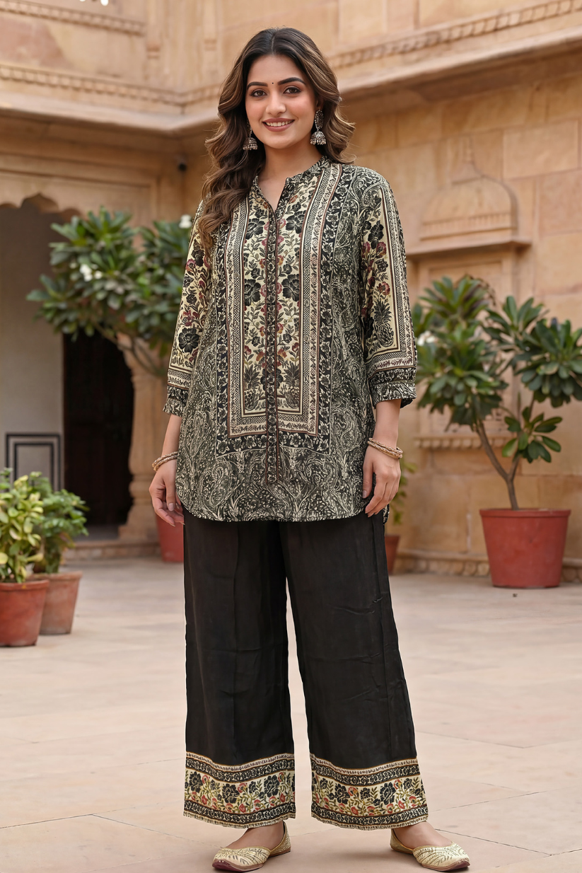Woman wearing black printed kurta pant set with ethnic floral prints and wide leg pants