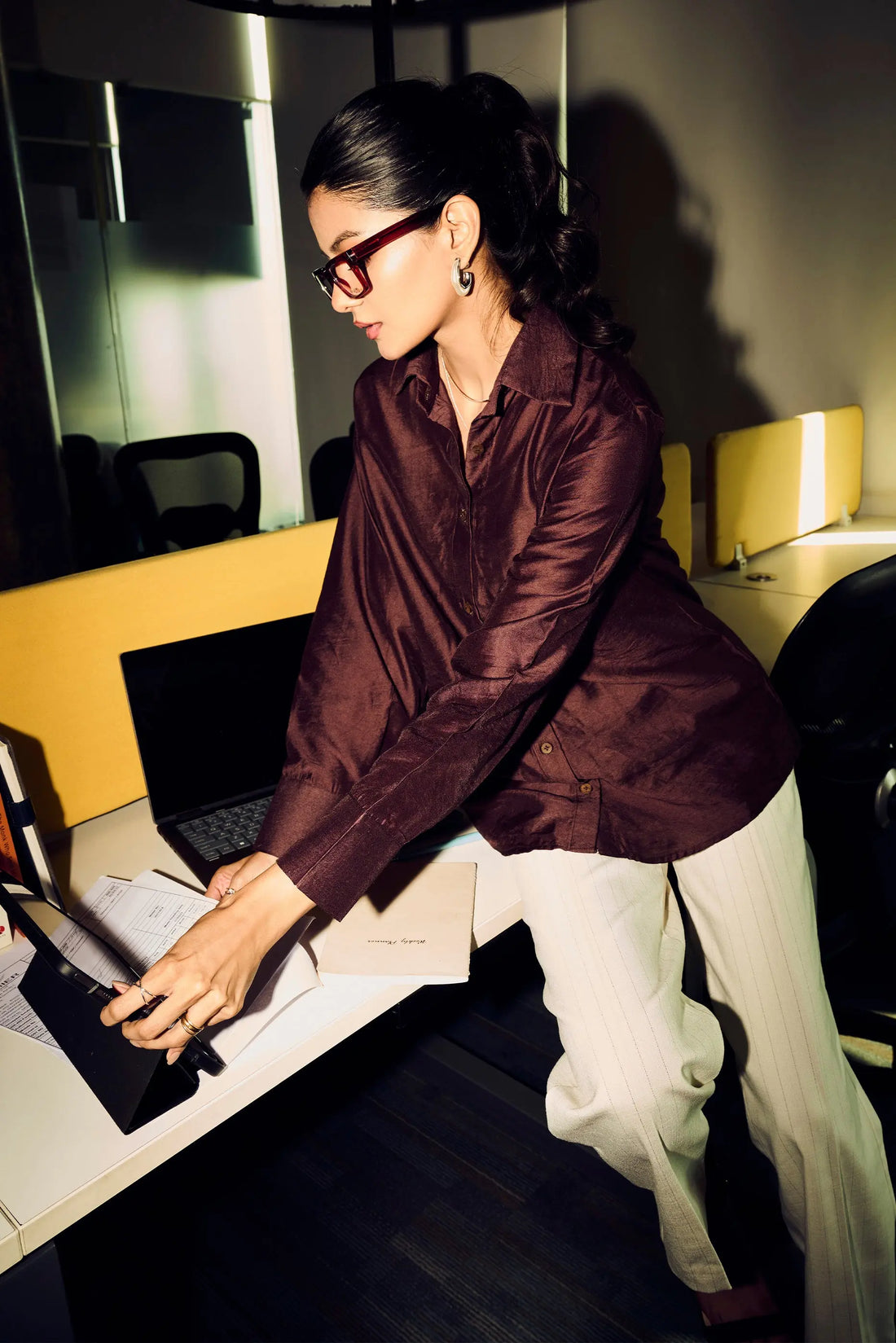 Woman wearing a brown Chanderi regular fit shirt styled for elegant office wear fashion