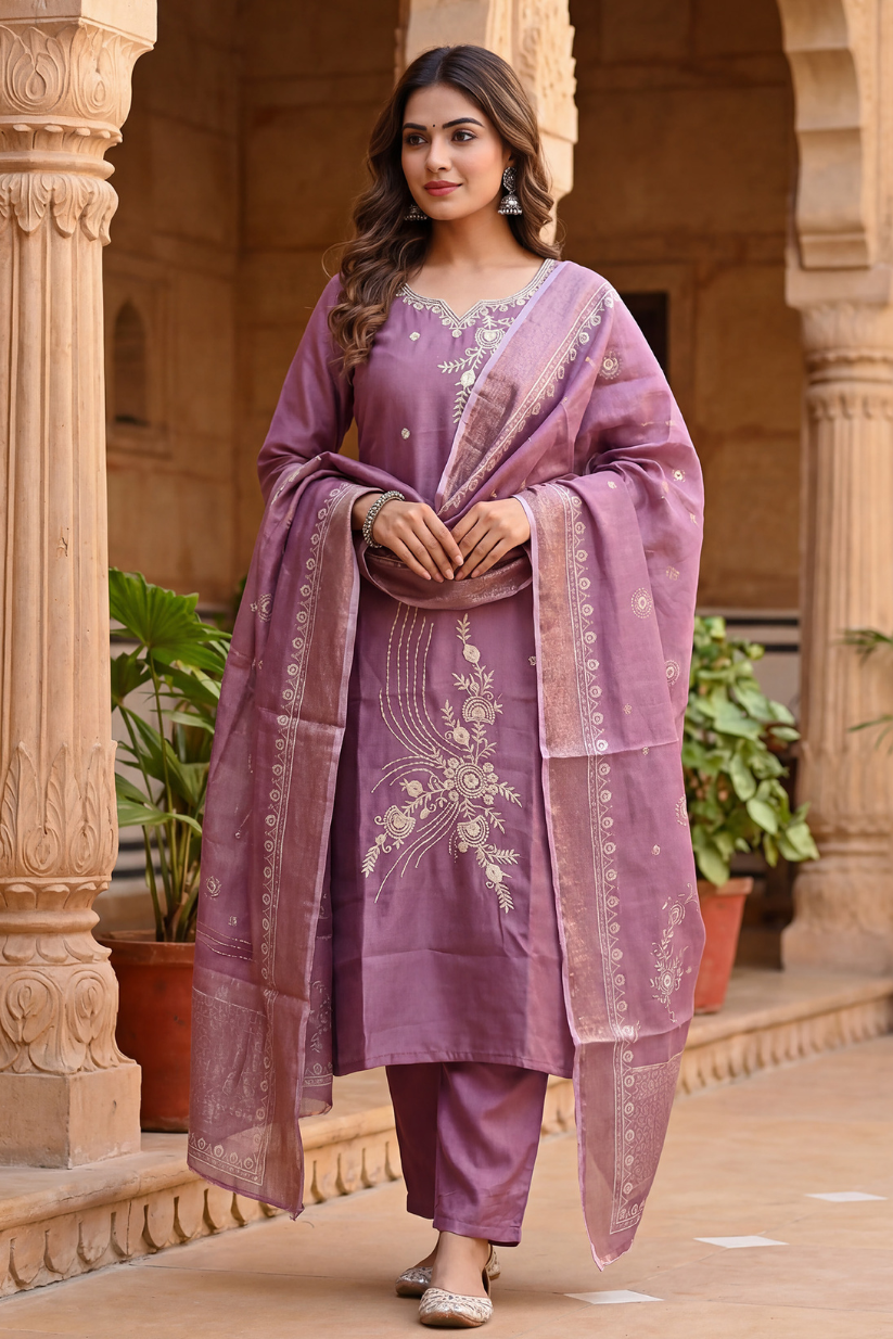 Woman wearing dusty mauve embroidered kurta set with dupatta and straight pants for festive ethnic wear
