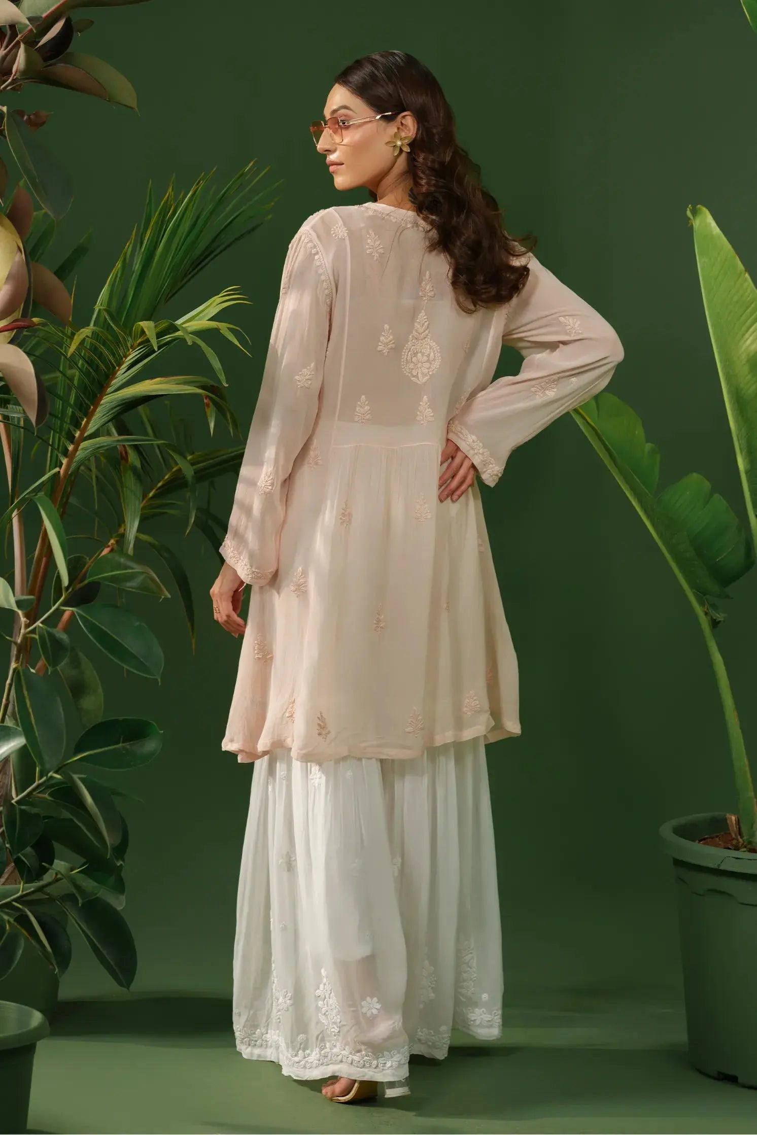 Side view of women georgette embroidered chikankari kurti