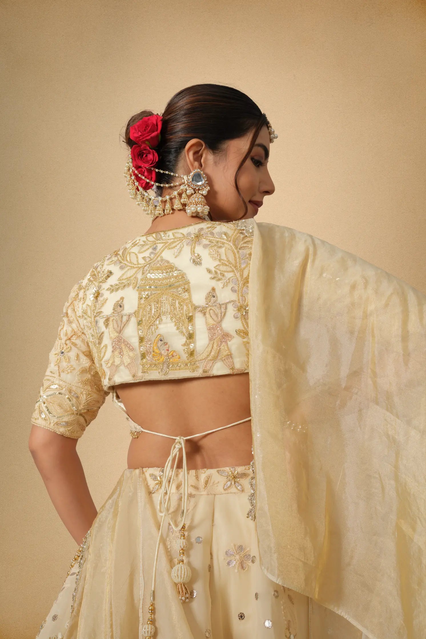 Back blouse design of golden festive lehenga set
