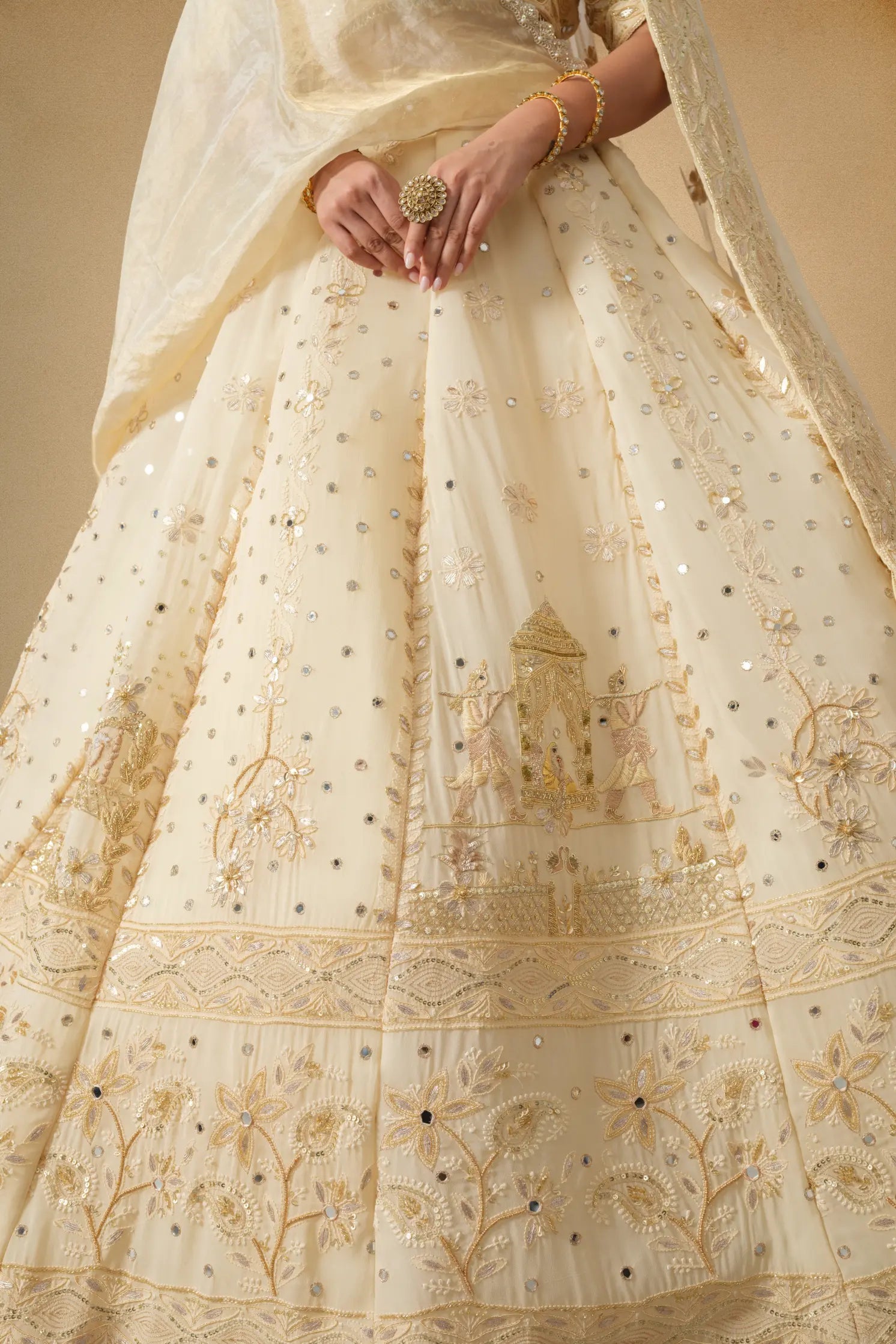 Side flare view of golden designer lehenga for women