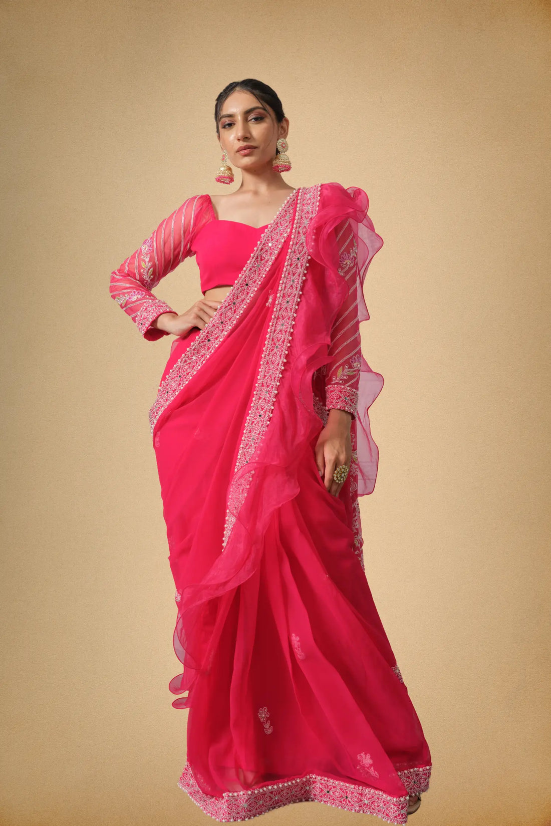 Hot pink designer saree with organza ruffle border front view