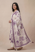 Side view of ivory floral printed kurta set with purple dupatta for women ethnic wear