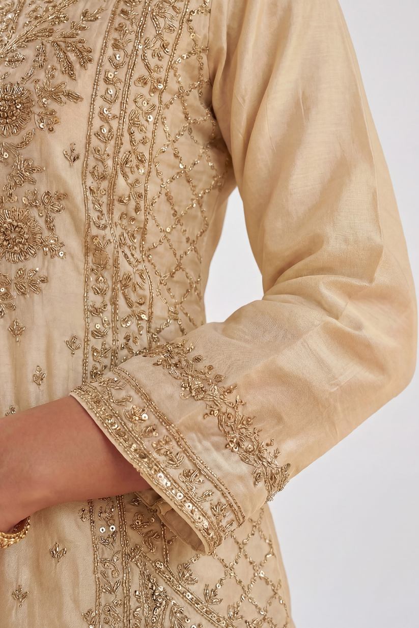 Embroidered sleeve detailing on ivory gold kurta for women