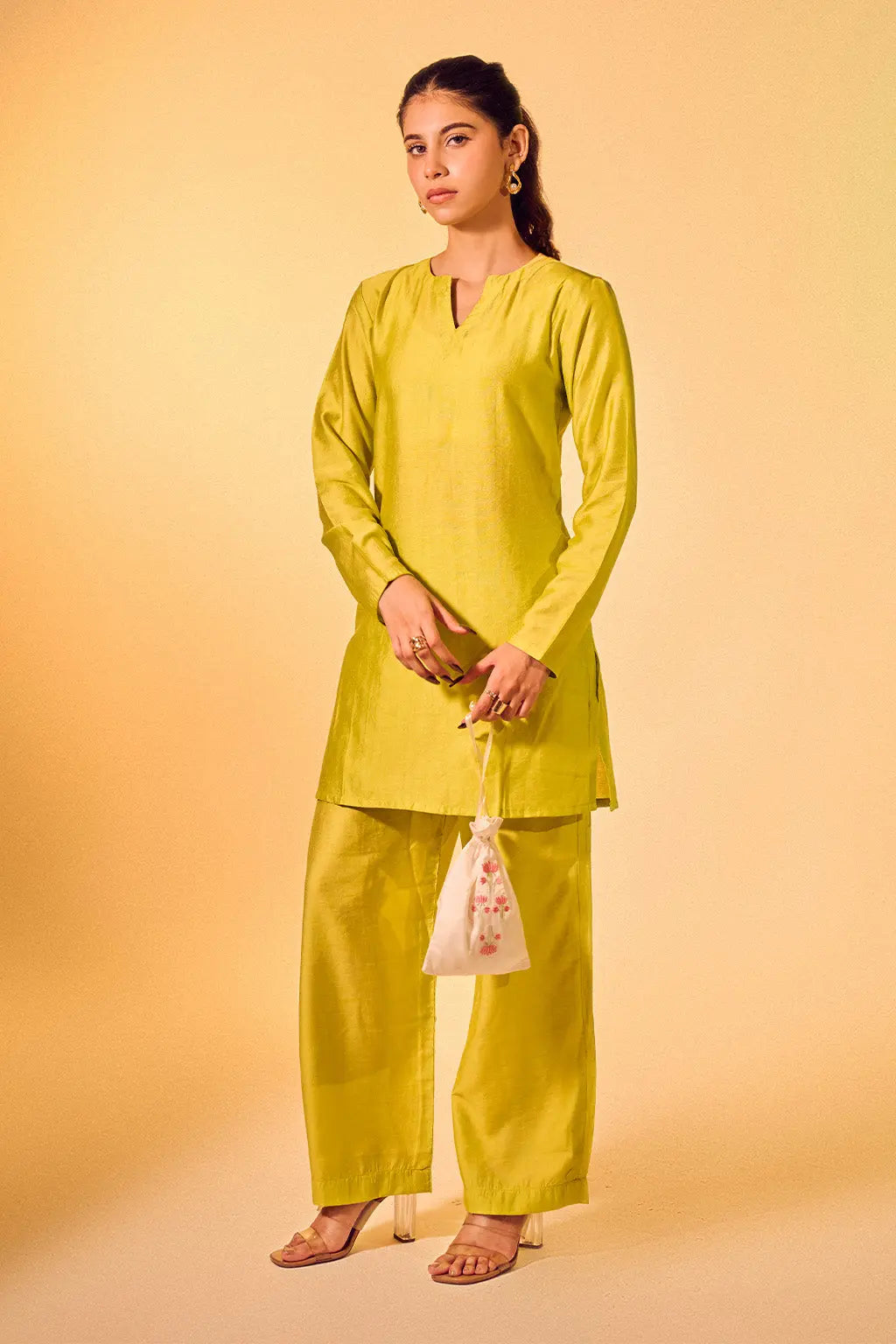 Full look of lime green Chanderi kurta set for women with straight pants and potli bag