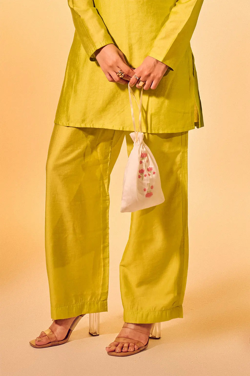 Close-up of lime green Chanderi straight pants with ethnic kurta set for women