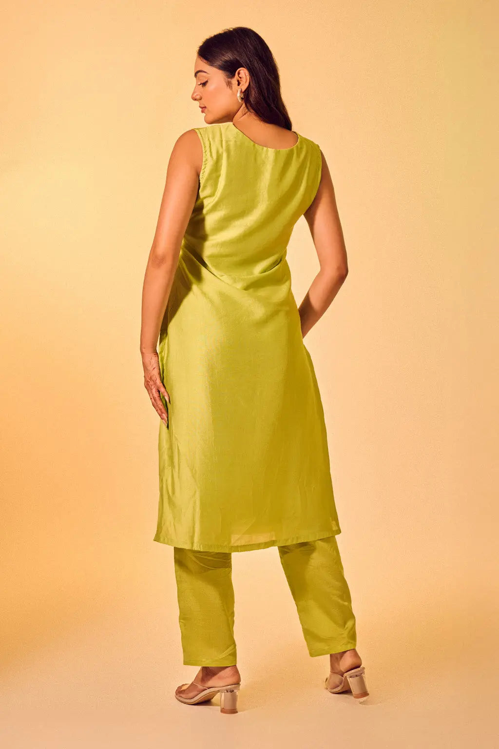 Back view of lime green sleeveless co-ord set for women with straight pants