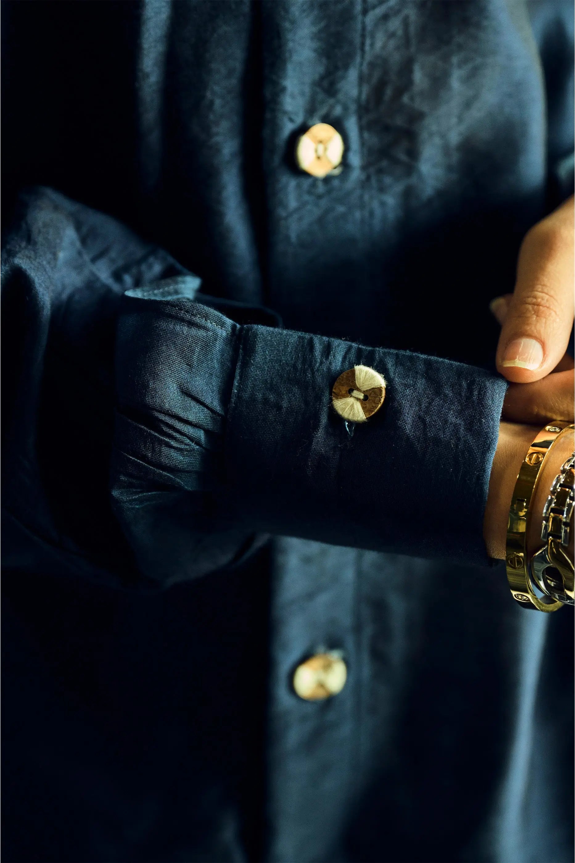 Close-up cuff and button detail of navy blue Chanderi shirt for women