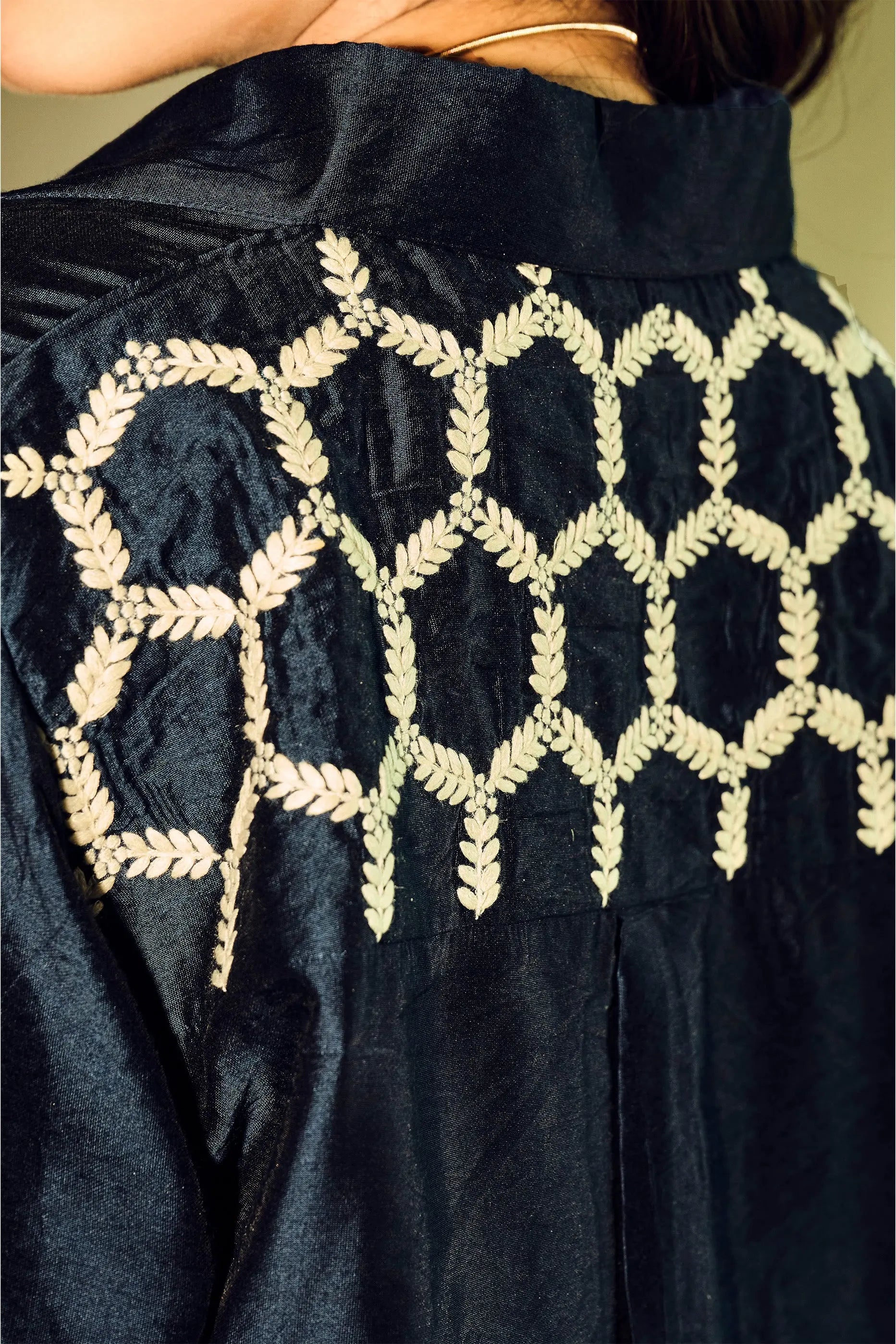Close-up back embroidery detail on navy blue Chanderi shirt for women