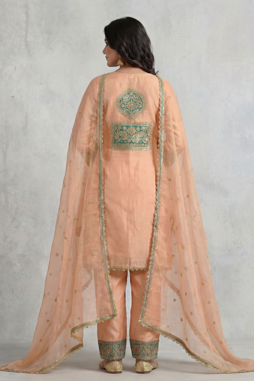 Back view of women peach teal embroidered kurta set