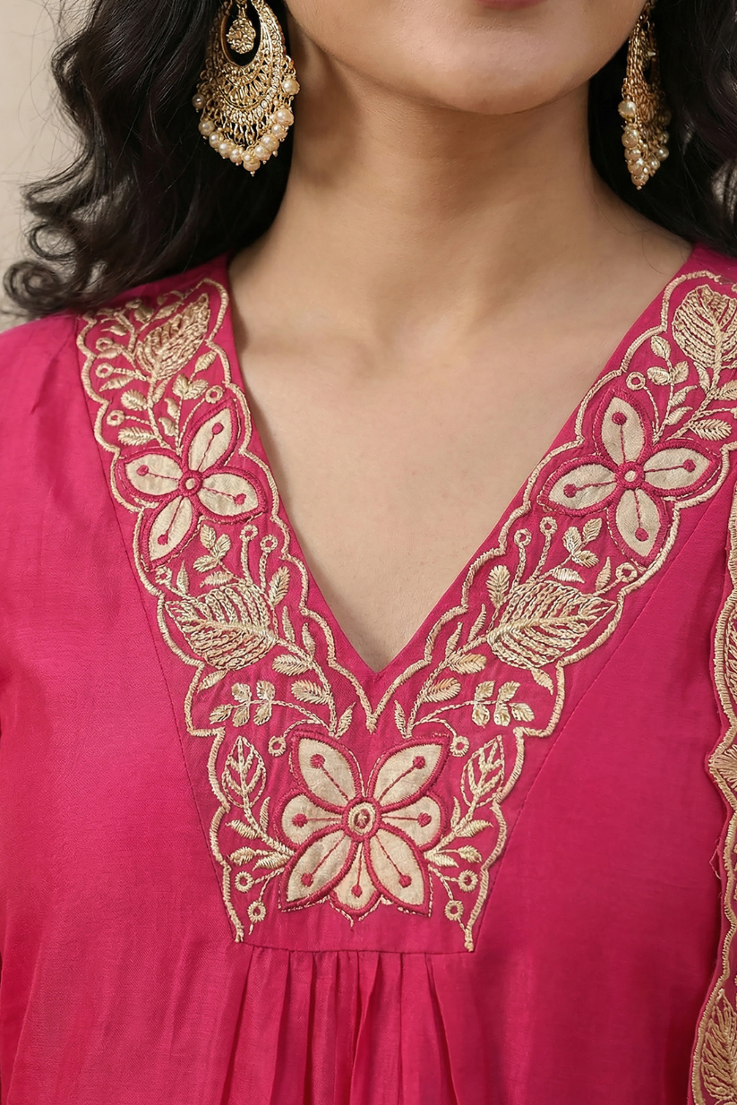 Close-up of embroidered V-neckline on pink ethnic kurta with floral detailing