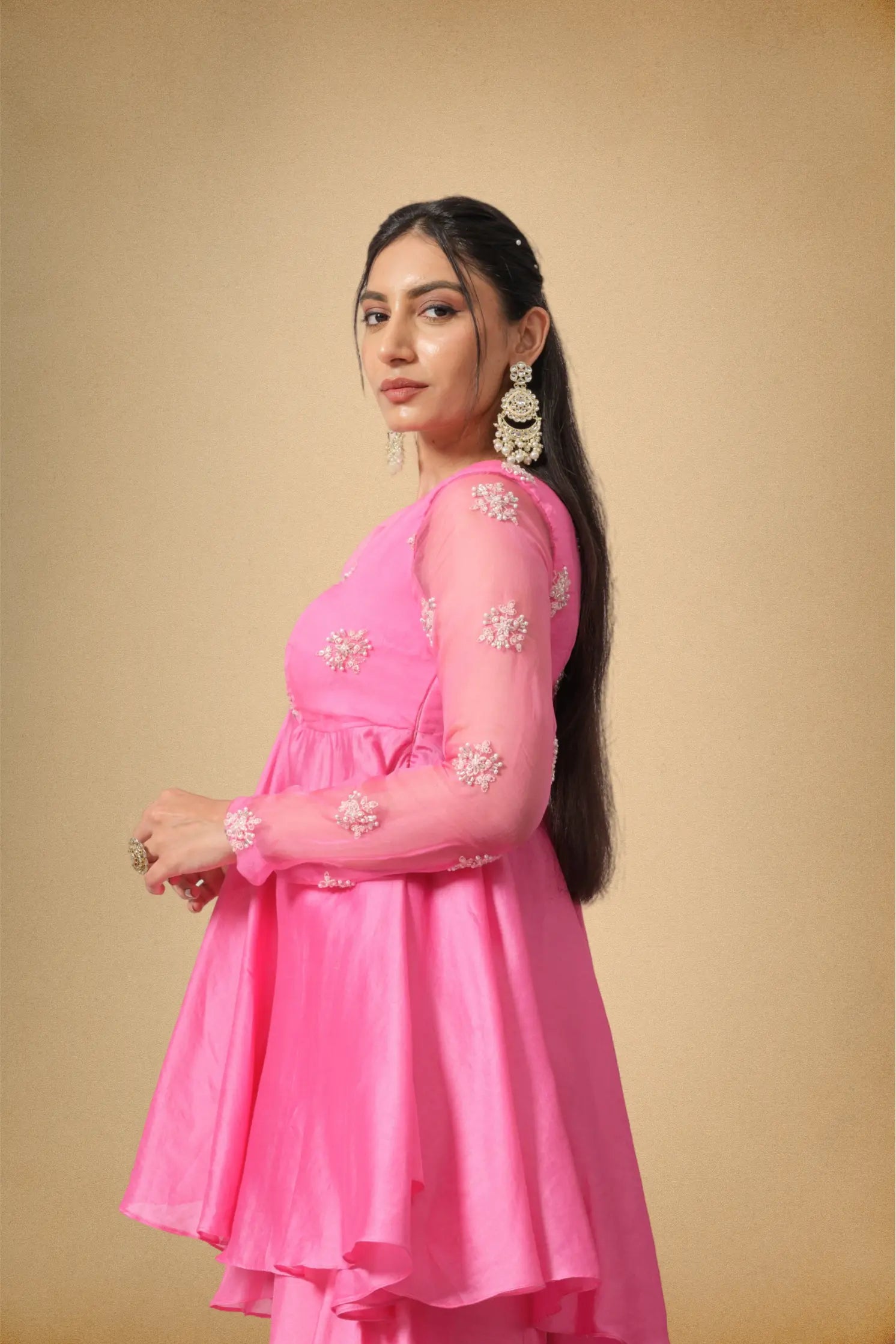 Side view of pink layered Chanderi kurti and sharara set