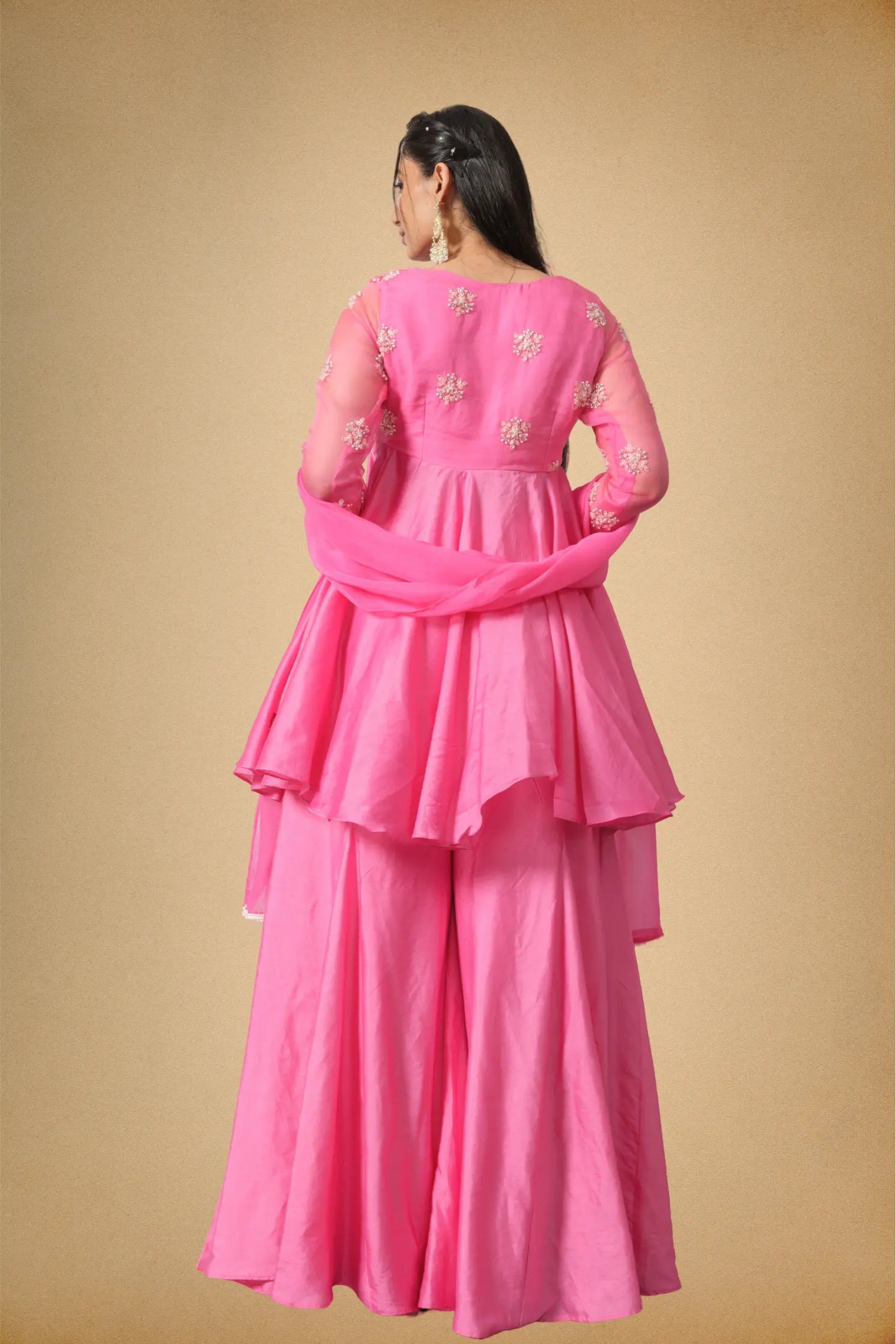 Back styling of pink Chanderi sharara set for women