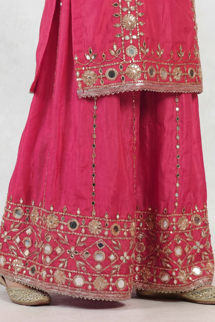 Detailed embroidery design of rani pink festive sharara set