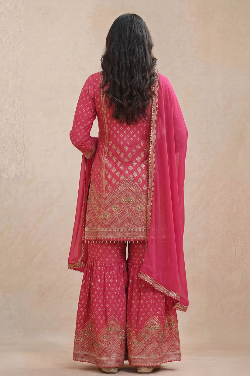 Back view of rani pink embroidered sharara kurta set with dupatta for women