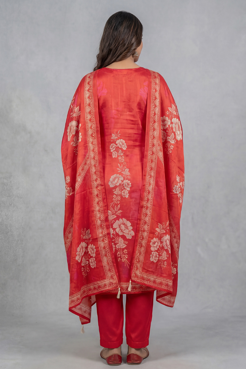 Back view of red printed kurta set with dupatta and straight pants for women