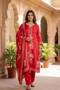 Woman wearing red printed kurta set with mirror work dupatta front view