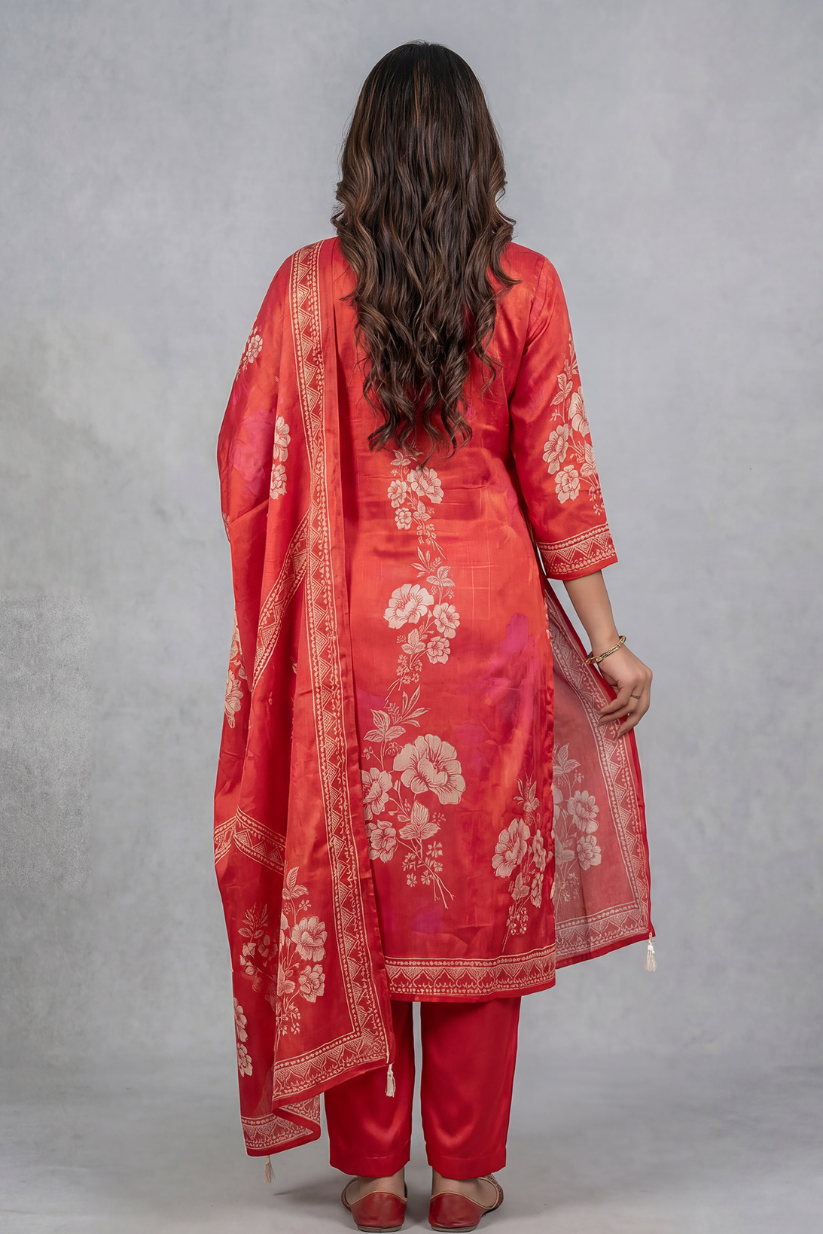Rear full look of red printed kurta set with dupatta and straight pants for women