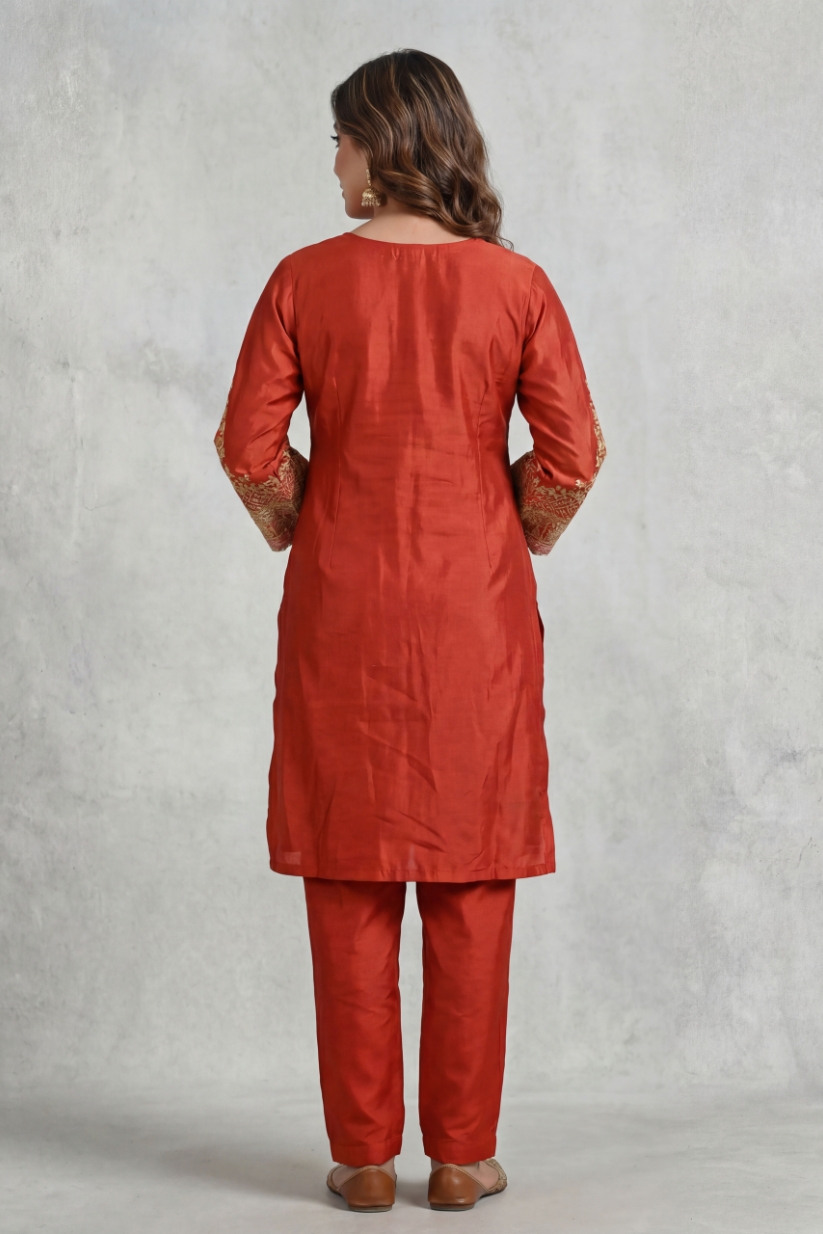 Back view of women rust red embroidered co-ord set