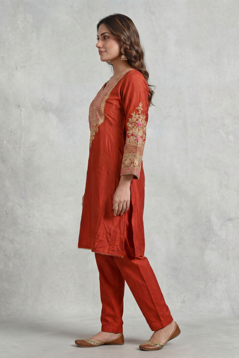 Side view of rust red embroidered co-ord set for women
