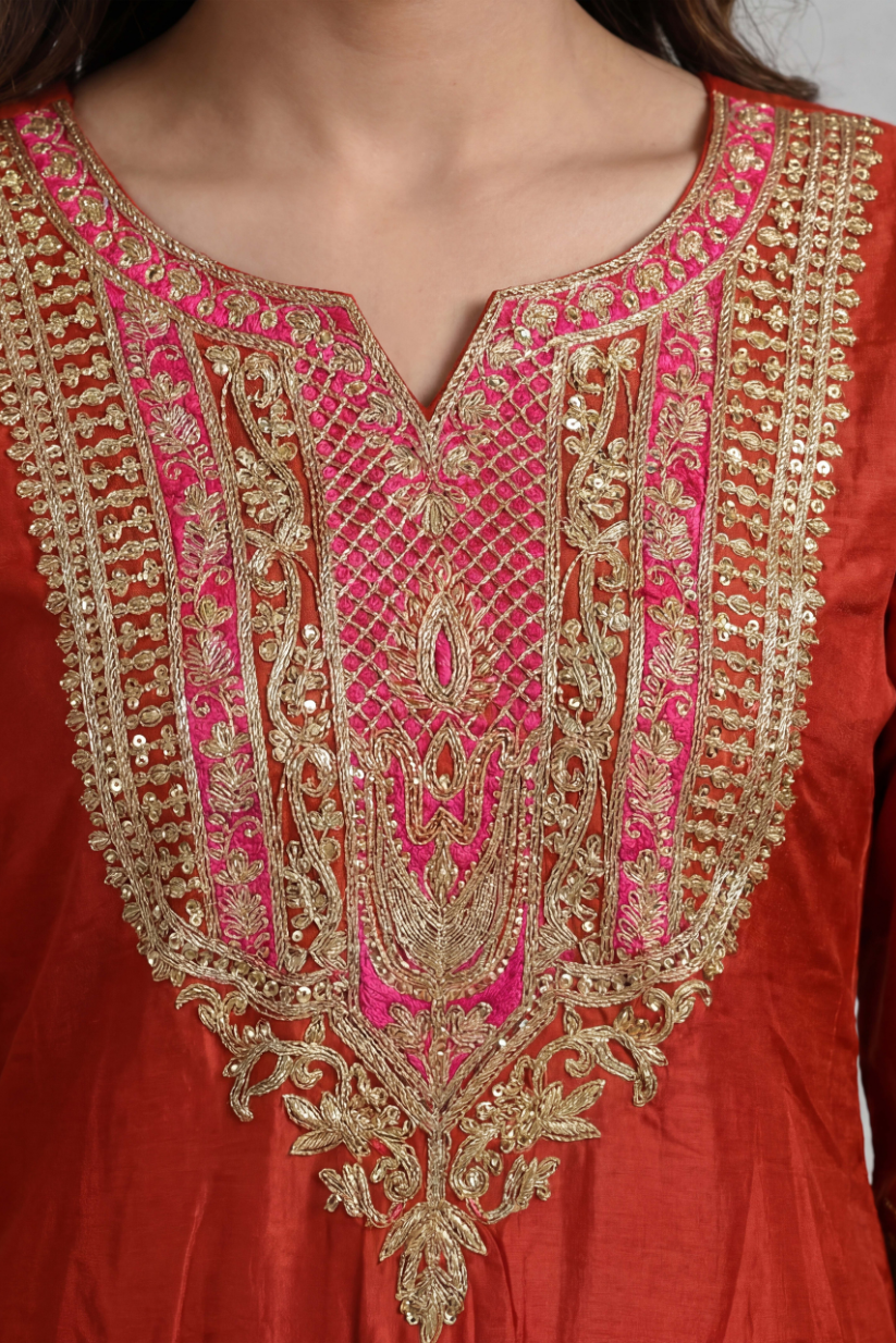 Close look of rust red embroidered kurta for women