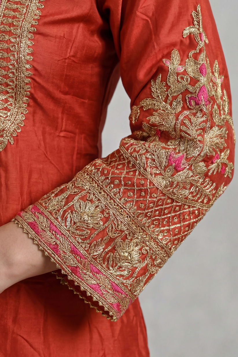 Embroidered sleeve detailing on rust red festive kurta