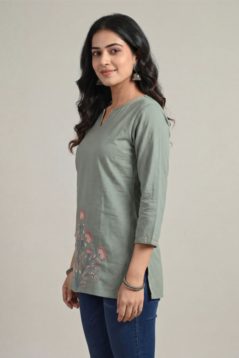 Side fit view of sage green cotton short kurti paired with blue jeans for women casual wear