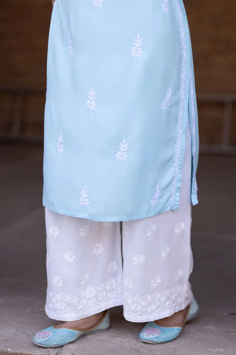 Sky blue embroidered kurti paired with white palazzo pants for ethnic wear