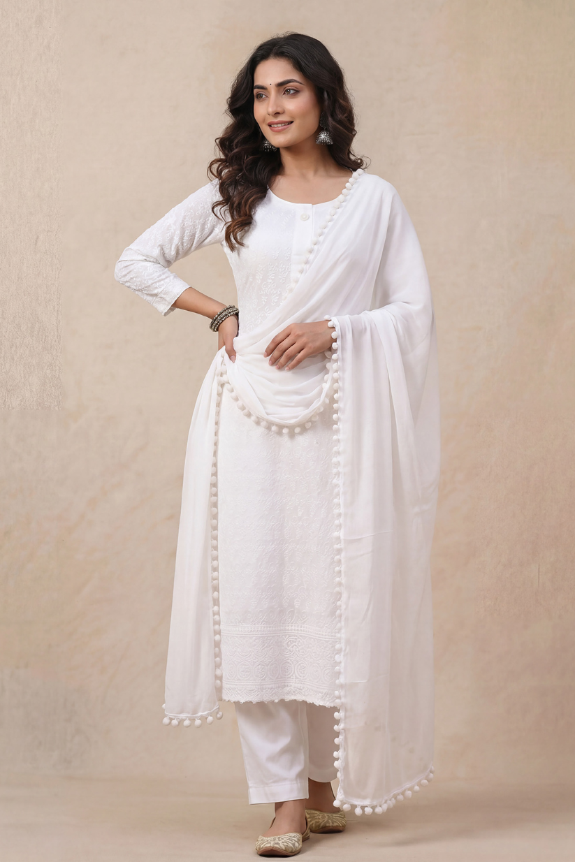 Woman wearing white chikankari embroidered kurta set with dupatta front look