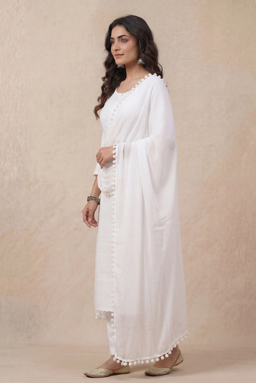 Side view of white chikankari style kurta set with dupatta for women