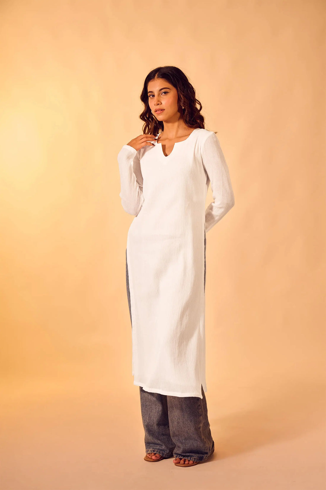 Woman wearing white cotton V-neck kurti for everyday and office wear