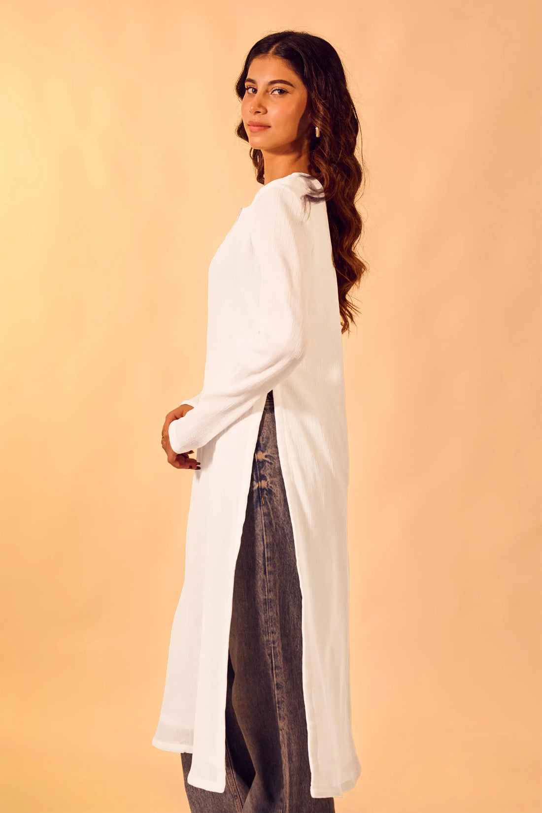 Woman wearing white cotton V-neck kurti for everyday and office wear