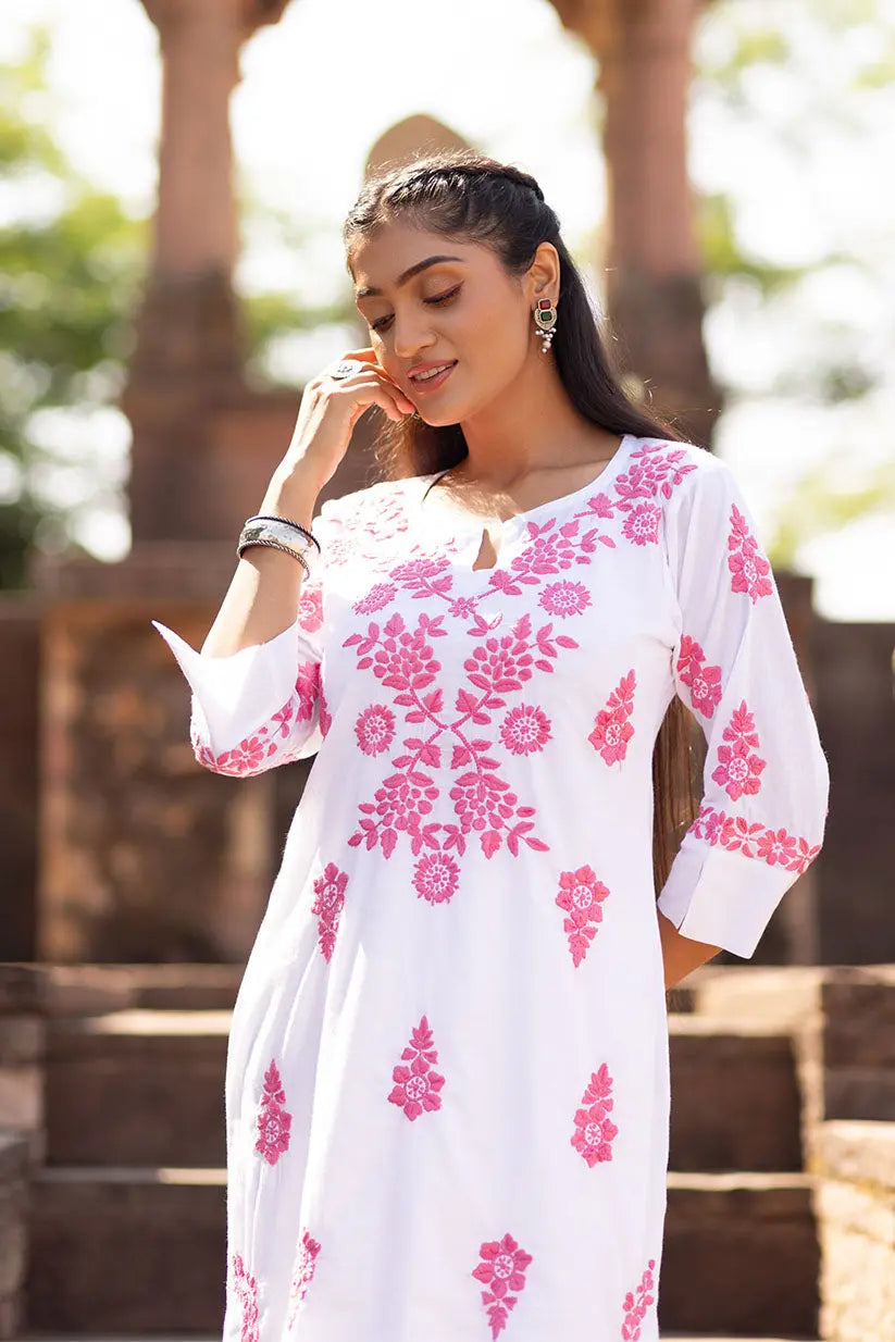White straight kurti with pink Chikankari embroidery for women front view