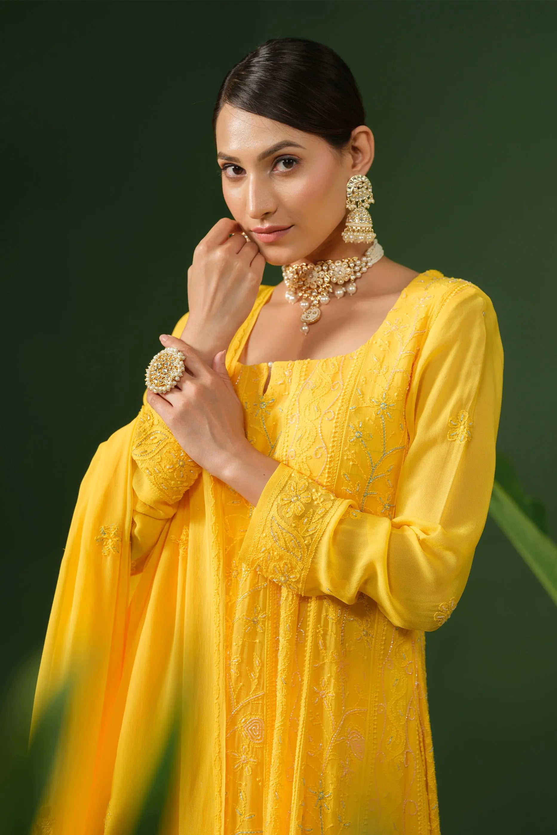 Closeup of yellow chikankari georgette Anarkali suit